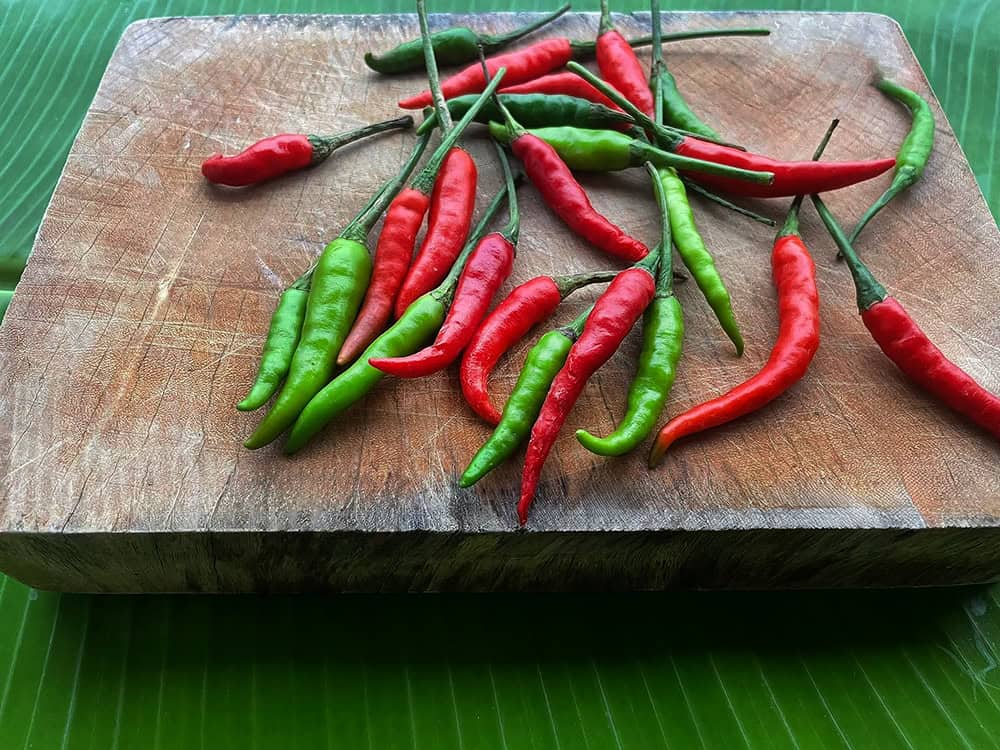 Thai Prik Chee Fah chilies on a cutting board.