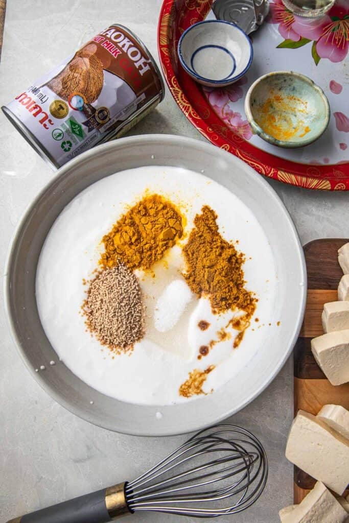 Satay spices and sauce in a bowl.