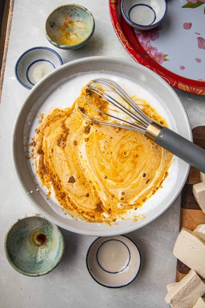 Whisked satay sauce in a bowl. 