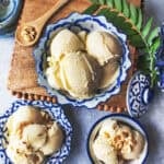 3 Durian Ice cream in thai blue bowls on a table.