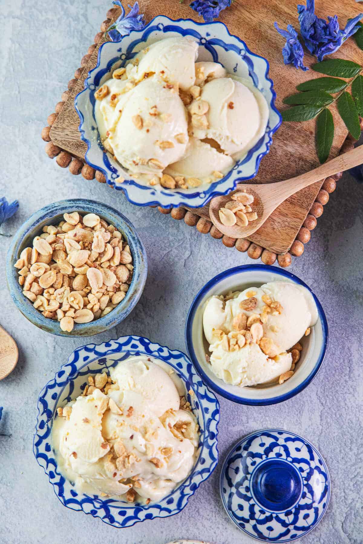 Durian ice cream in small Thai pottery bowls with crushed peanuts on top.