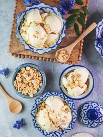 3 Durian Ice cream in thai blue bowls on a table.