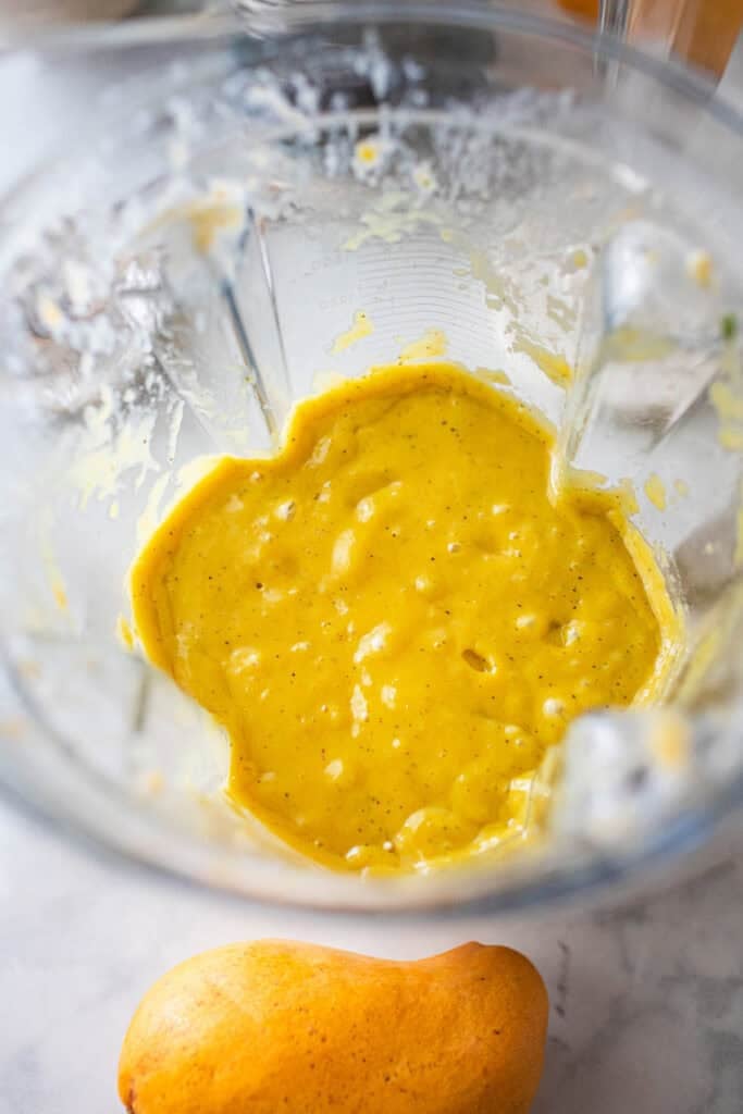 Mango smoothie puree in a food processor. 