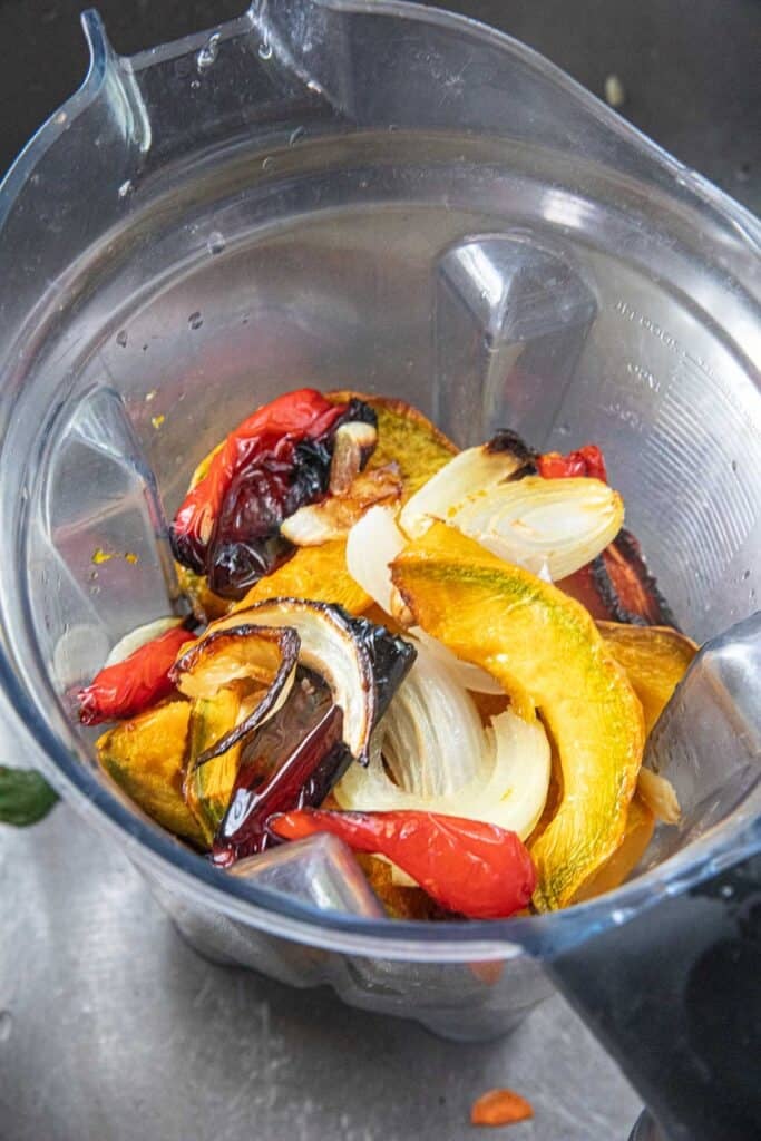 Roast pumpkin, peppers, onion, and garlic in a blender for a Thai curry with pumpkin recipe.