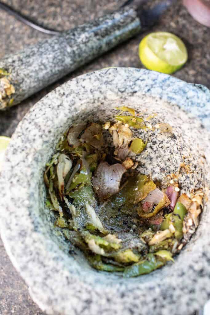 Nam Prik Noom ingredients in a mortar and pestle.
