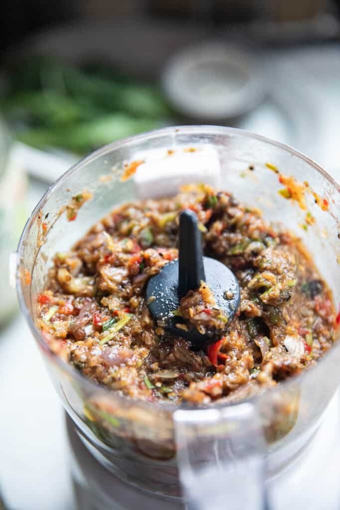  A blender filled with a blended Thai eggplant dip. 