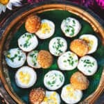 Round kanom krok coconut pancakes on a basket.