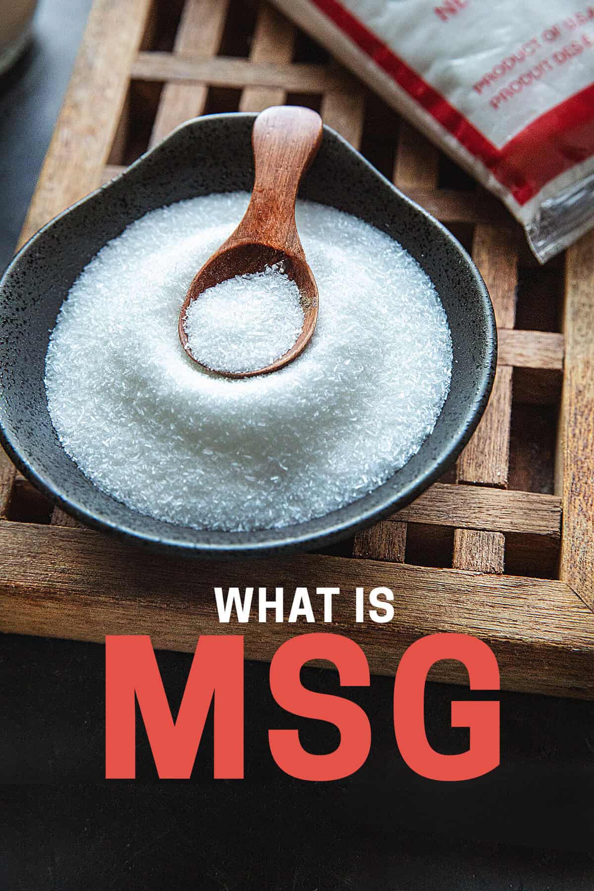 MSG grains in a small bowl with text overlay that reads, "what is MSG".