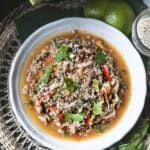 thai pork laab salad in a plate on the table.