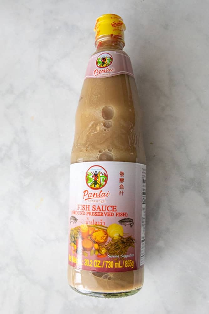 Pla Ra, fermented fish sauce in a bottle on the table.