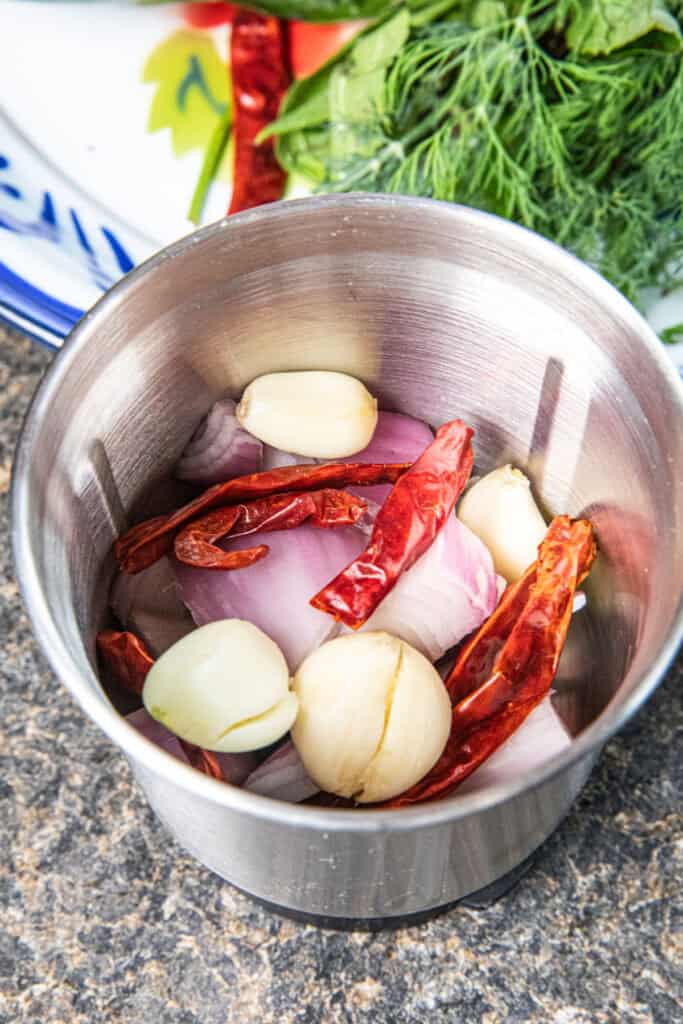 Chili, garlic, and shallot paste for Gaeng Om Gai prepared in a food processor.