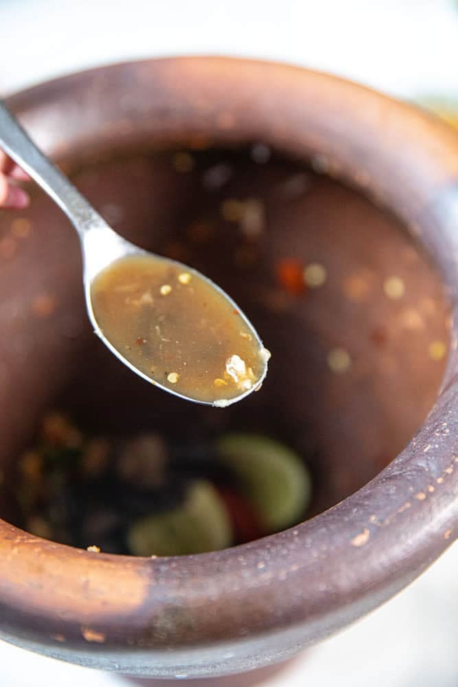 Fermented crab added to papaya salad.