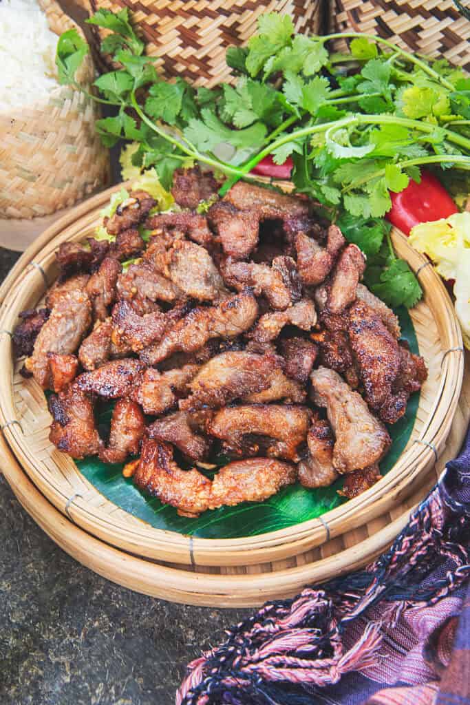 Moo Tod served with sticky rice and Isaan dipping sauces.