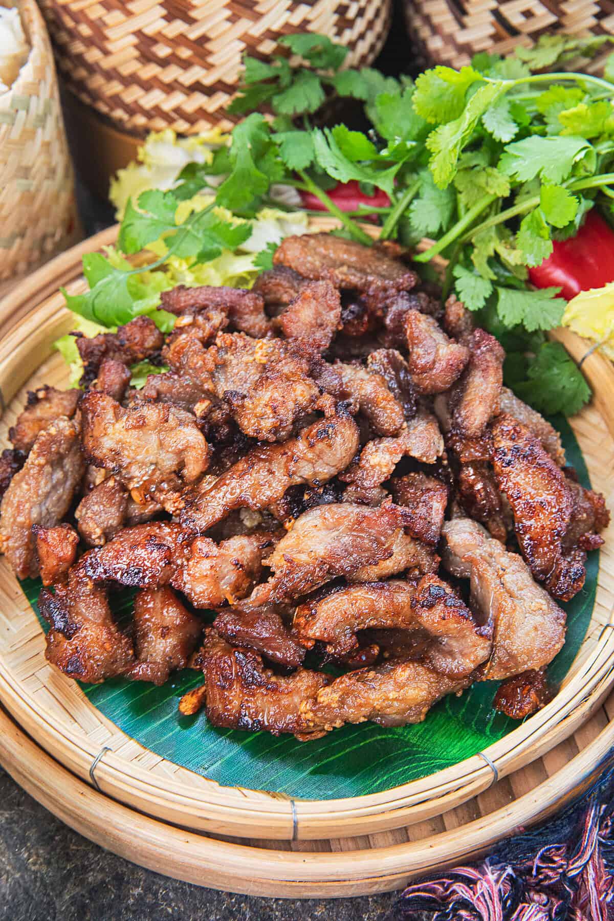 Moo Tod thai fried pork served with sticky rice and Isaan dipping sauces.