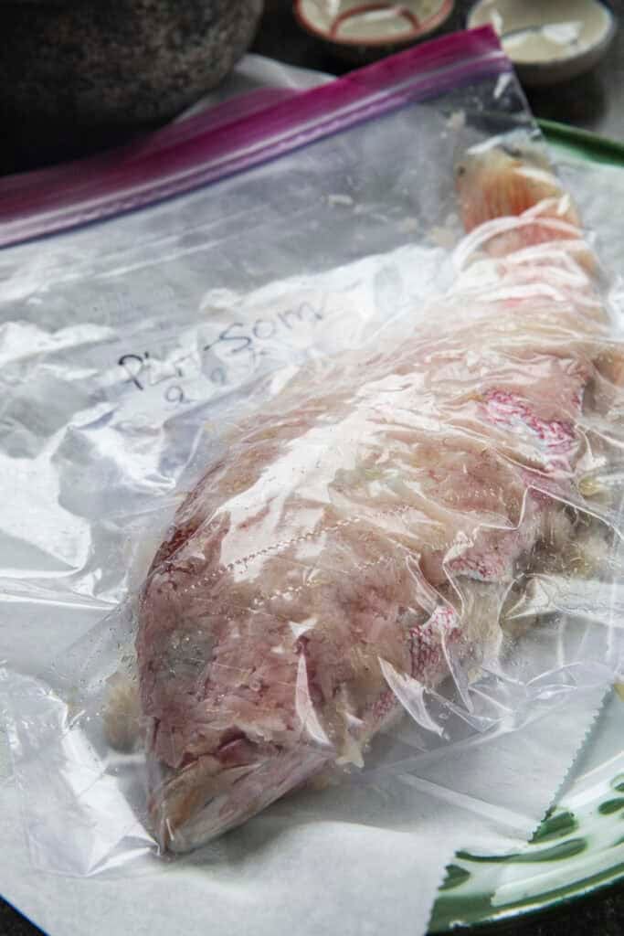 Pla Som fish sealed in a bag during two day fermentation process.