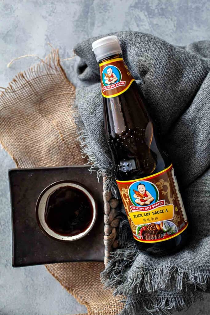Thai black soy sauce bottle used for dark color and glossy noodle dishes.