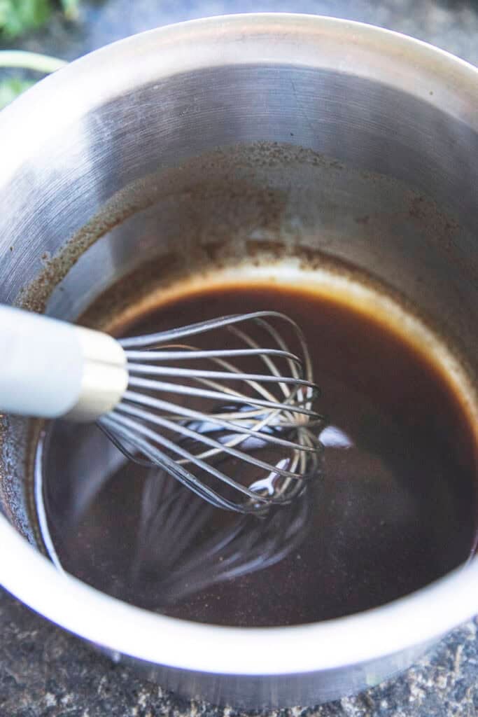 Sweet and savory Poh Pia Sod sauce cooking in a saucepan.