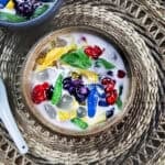 Ruam Mit Thai dessert with colorful tapioca noodles, Tub Tim Grob, jackfruit, corn, coconut milk, and crushed ice.
