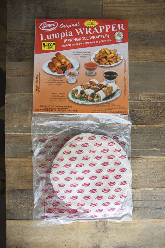 Lumpia wrappers for making Thai poh pia sod on the table.