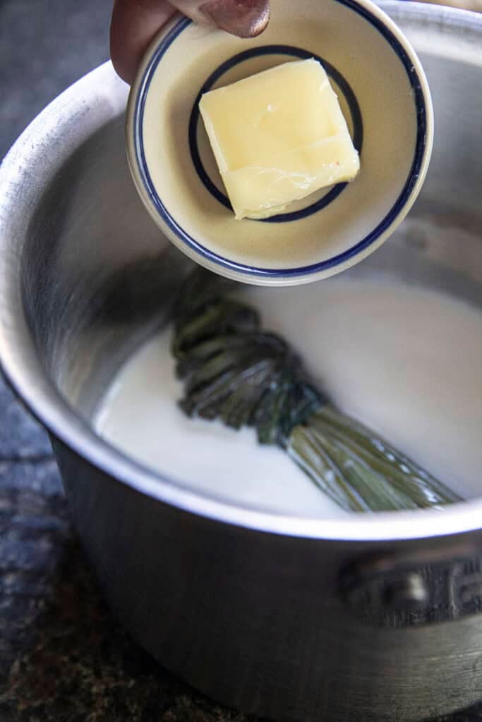 Adding butter to coconut palm sugar sauce.