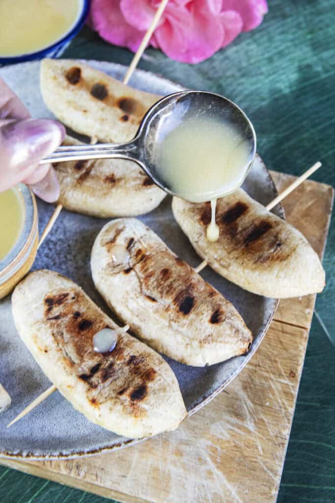 Coconut palm sugar sauce drizzled over Thai grilled bananas.