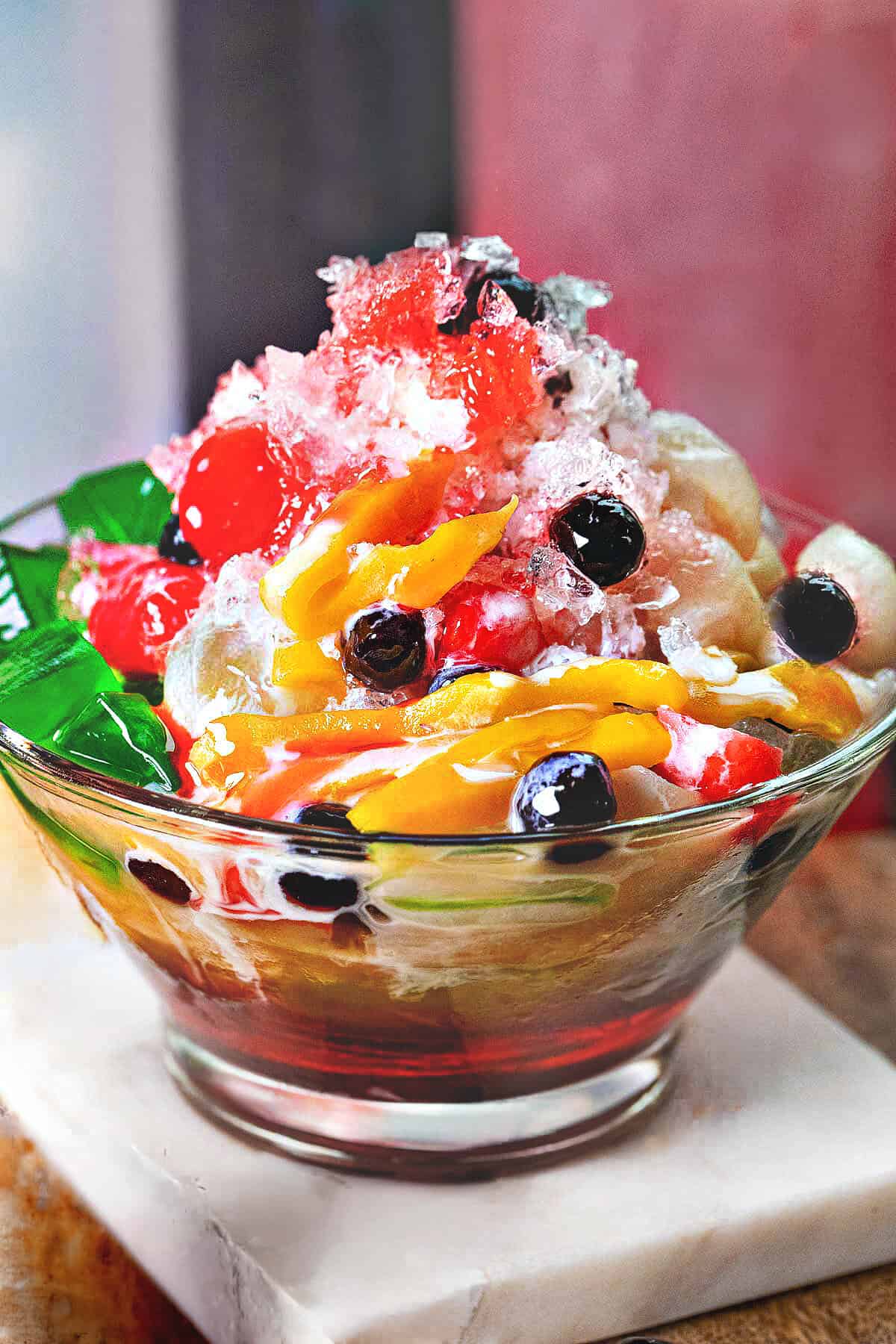 Nam Khaeng Sai with shaved ice, jackfruit, boba, colorful jellies, sala syrup and condensed milk.