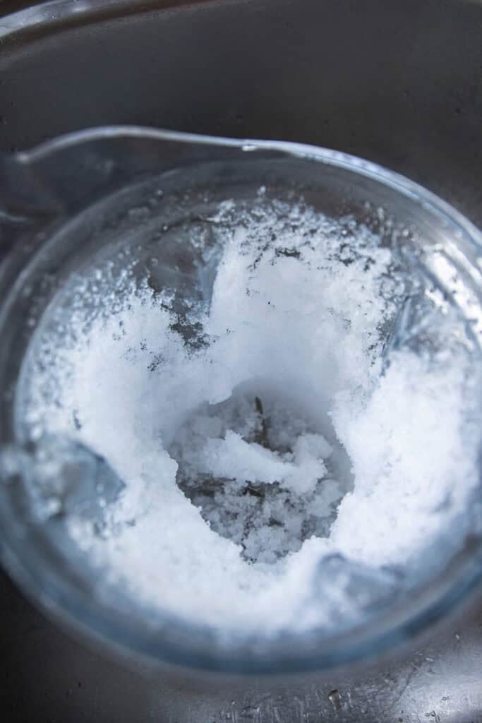 Finely crushed ice in a blender for Nam Khaeng Sai