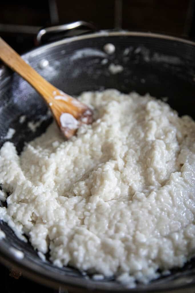 Thai sticky rice cooking in sweetened coconut milk.