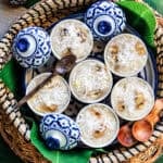 Khanom Kluay Thai steamed banana dessert topped with shredded coconut.