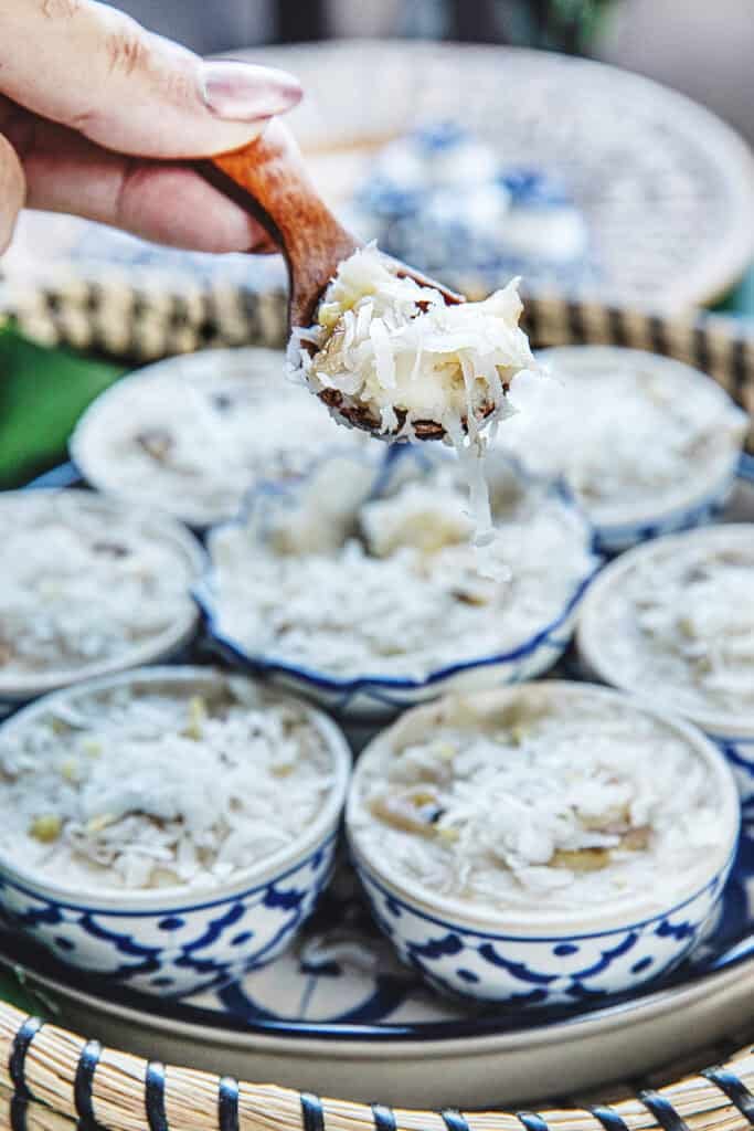 Soft and chewy Khanom Kluay with banana and shredded coconut.